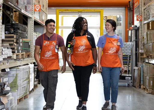 Home Depot team walking through store, representing career growth and teamwork