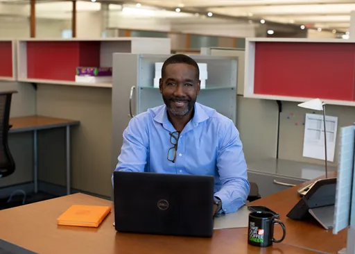 Home Depot Canada corporate associate working at a desk in an open office environment.